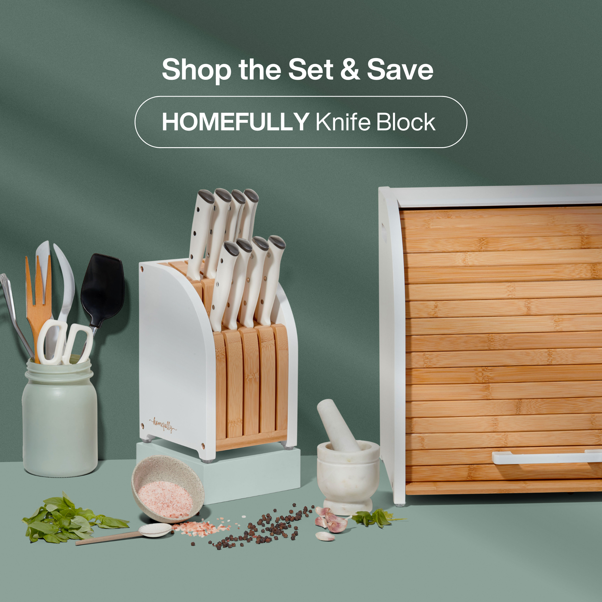 Kitchen counter with a breadbox, mugs, and decorative items.