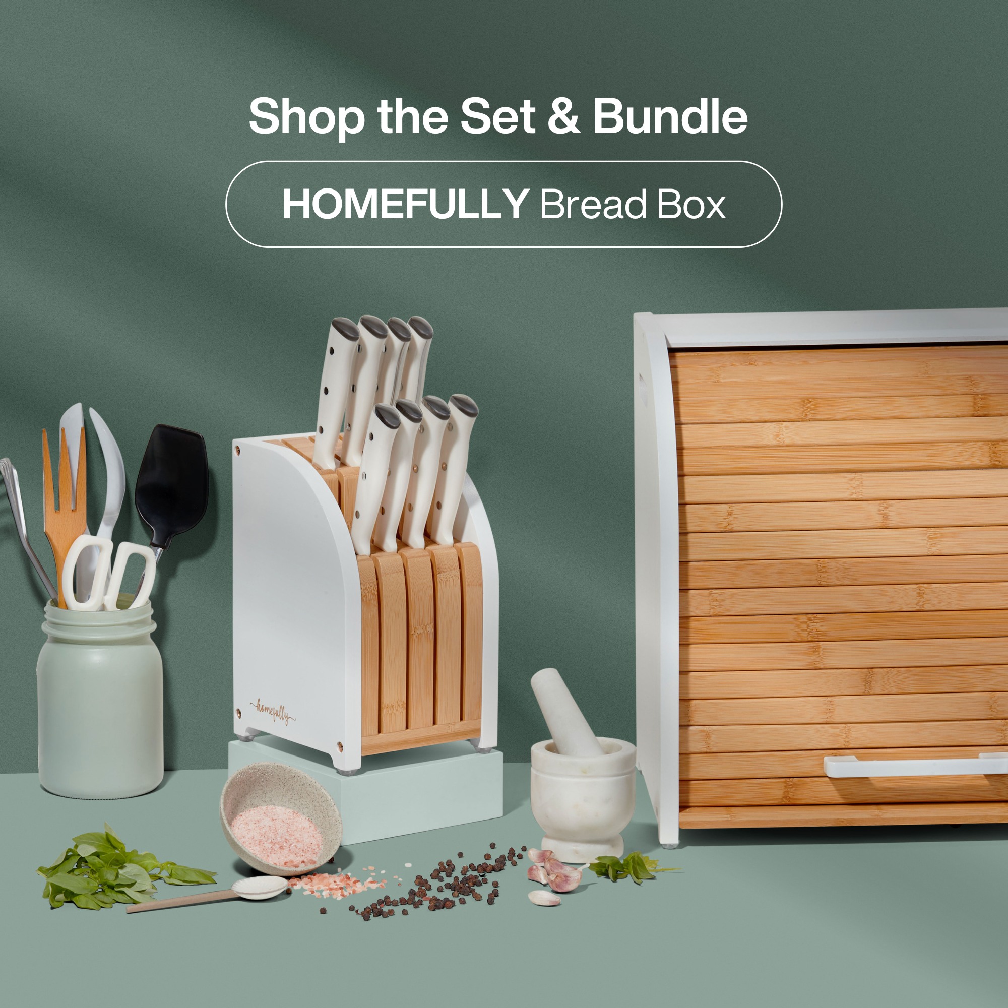 Kitchen counter with a breadbox, mugs, and decorative items.