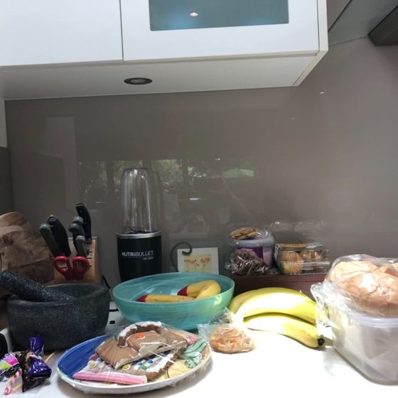 Dean's bench before: bread bags, rolls and baked goods loose on the bench