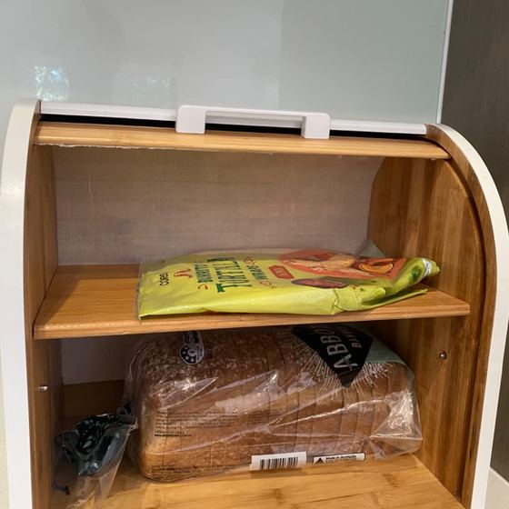 Open bread box with sliced bread on both shelves