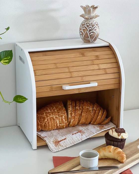 Bread box open with loaves