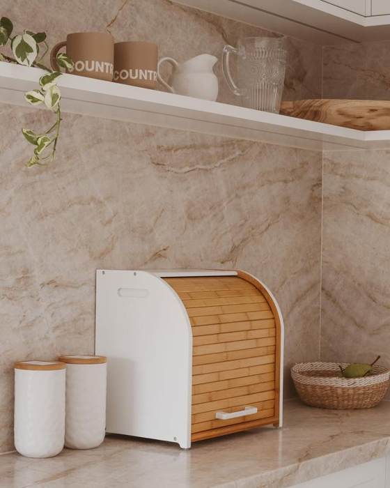 The bread box against a marble splashback