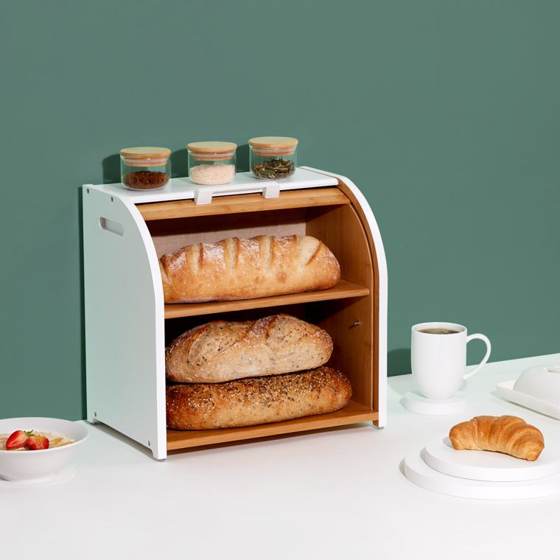 White bread box open, with loaves on both shelves