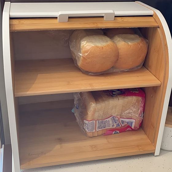 Open bread box with loaves